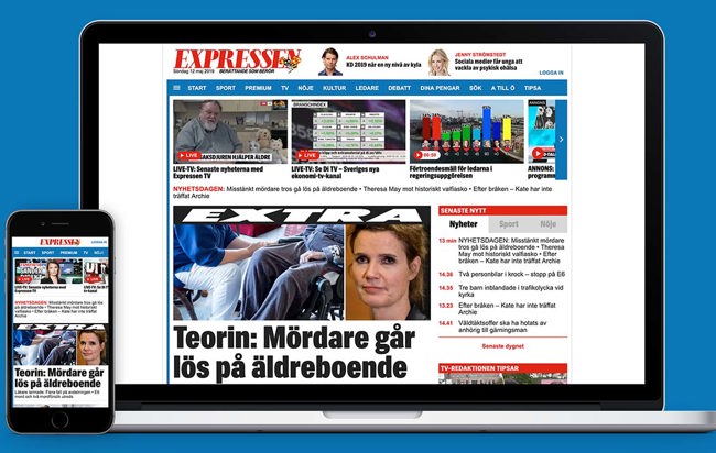 Bild på MacBook med Iphone som har en expressen tidningssida uppe